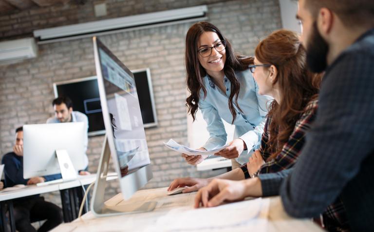 shutterstock_1391807393.jpg Scrum master working with project team members