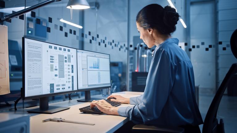 shutterstock_1899126973.jpg Business analyst working at her computer